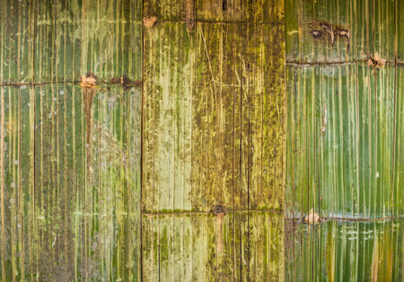 The pattern of bamboo weave wall of traditional bungalow house in countryside, Thailandの写真素材