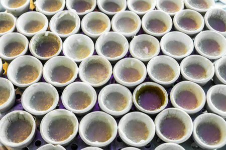 Small porcelain cups of coconut milk custard in Thai fresh marketの写真素材