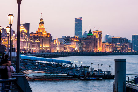 SHANGHAI, CHINA - FEBRUARY 1, 2015: Landscape view at the Bund with the pier in the evening. The Bund is a waterfront area in central Shanghai.のeditorial素材