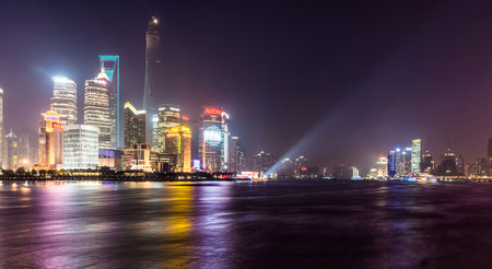 SHANGHAI, CHINA - FEBRUARY 2, 2015: Pudong landmarks at night. Pudong is a district of Shanghai, China, located east of the Huangpu River across from the historic city center of Shanghai in Puxi.のeditorial素材