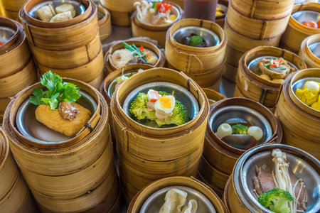 Small steamer baskets of Dim Sum in restaurantの写真素材