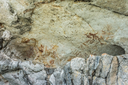 The ancient art of cave painting in mountain of Phang Nga bay national park of Thailandの写真素材