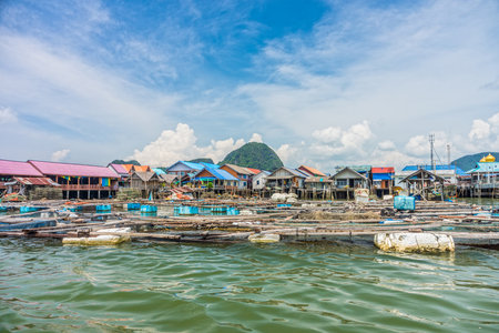 Floating baskets for keeping live fish in water at local village in Phang Nga bay, Southern Thailandの写真素材