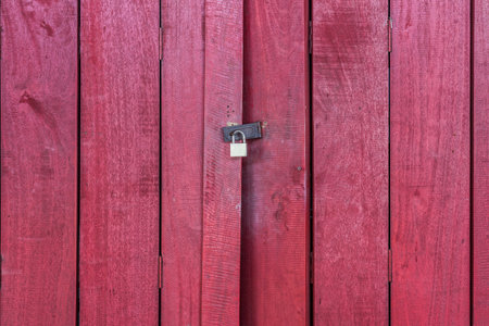 The red wooden door with lock