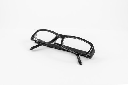Black eye plastic glasses isolated on white backgroundの写真素材