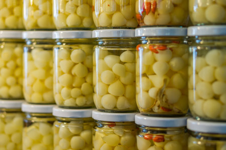 Pickled elephant garlic packed in glass jar for sale in Thailand food market