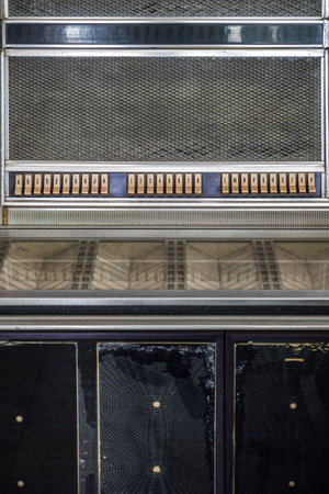 Old classic jukebox. It is a partially automated music-playing device.