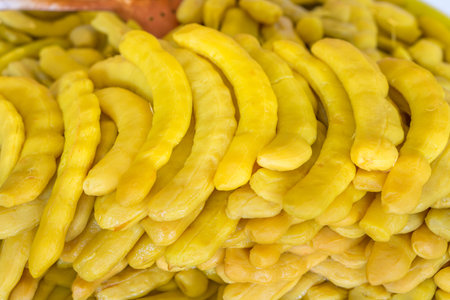 Heap of sweet pickled tamarind fruits for retail sale in Thailand food market. They are fruit preserves for long-term storage.の写真素材
