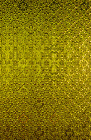 Vintage floral pattern on yellow glass. It is used for background and texture.の写真素材