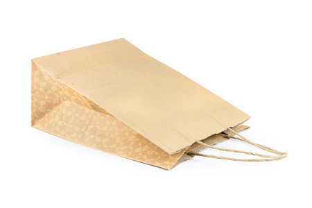 Brown kraft paper bag. It is isolated on white background.の写真素材