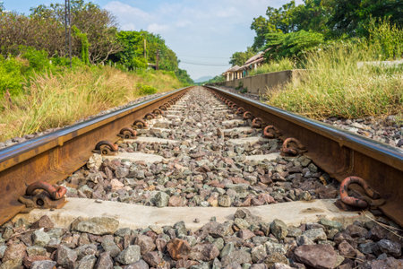 Train track nearby railway station in Thailand. The station is Pa Sak Chonlasit dam station.
