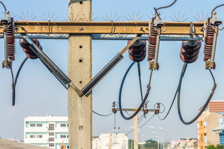 Closeup of overhead electric power transmission and distribution lines. It is power line system in Thailand.の写真素材
