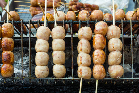 Roasted sausage on skewers for sale in Thailand. They are made of rice and pork.の写真素材
