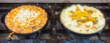 Making mussels omelet in Thailand food market. The dish is widely known in many parts of Asia.