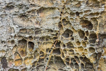 Rough texture on the rock for background. The erosion of wind and water on surface.の写真素材