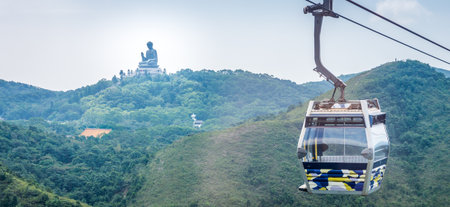 Tian Tan Buddha statue and cable car. Located at Ngong Ping, Lantau Island, in Hong Kong.の写真素材