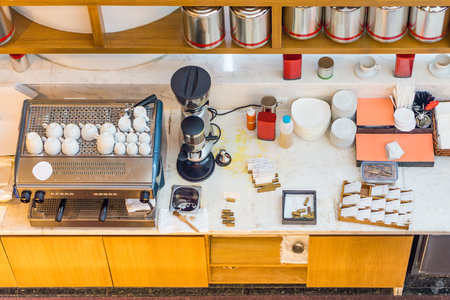 Top view of coffee counter bar. There are many tools and devices on counter top.