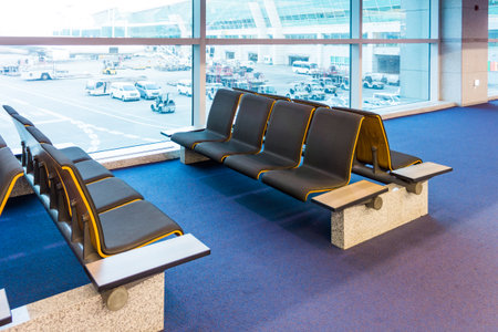 Seats in concourse of the airport. The interior in terminal lounge.の写真素材