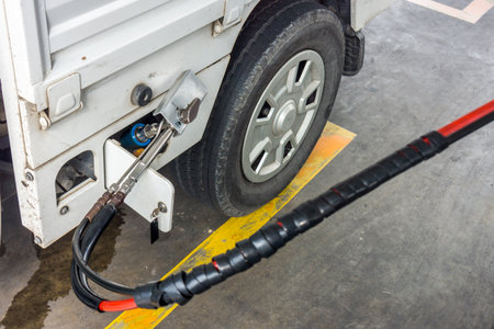 Fueling natural gas vehicle with CNG. It being filled in filling station in Thailand.の写真素材