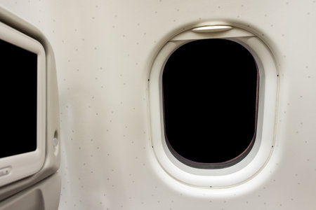 Airplane window on board flight with blank copy space . Travel and transportation by aircraft.