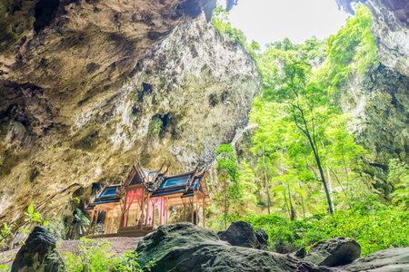 Khuha Kharuehat Throne in hollow place with hole on mountaintop. The tourist attraction at Phraya Nakhon cave in Khao Sam Roi Yot National Park, Prachuap Khiri Khan, Thailand.の写真素材