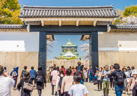 OSAKA, JAPAN - MAR 29, 2018: Osaka Japanese Castle Main Tower view from Sakura Gate. This is the main entrance located in the south which enters to it.のeditorial素材