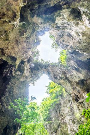 Two holes on mountaintop of Phraya Nakhon cave. The tourist attraction at Khao Sam Roi Yot National Park in Prachuap Khiri Khan, Thailand.の写真素材