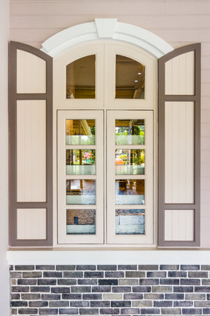 Casement windows with arched frame on top. It is designed in vintage European styles.