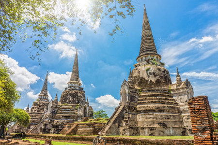 The three gigantic ancient pagodas in Wat Phra Si Sanphet, Ayutthaya, Thailand. It is built in the classic, Ceylonese design or bell shape.の写真素材