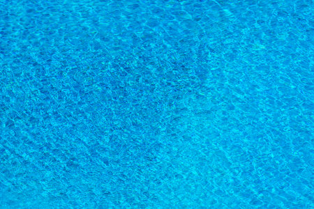 Rippled water for background. Water surface in swimming pool.の写真素材