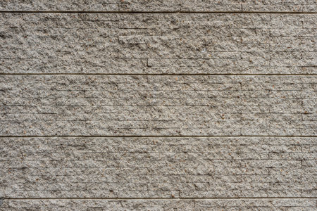 Pebble concrete tile wall. The new decoration of new-fashioned building.の写真素材