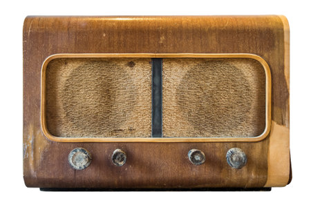Antique broadcast radio receiver isolated from white background. This old one is made of wood.の写真素材