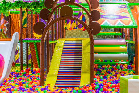 Indoor playground in building. It is an amusement park for children.の写真素材