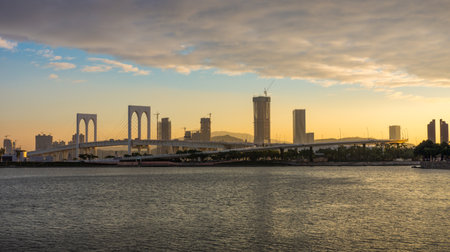 Ponte de Sai Van Bridge in the evening view from Sai Van Lake. It is a beautiful cable-stayed bridge in Macau, Chinaの写真素材