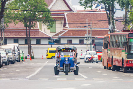 BANGKOK - AUG 28, 2019: Auto rickshaw with passengers at Phra Phi Phit road. It is an city transport...