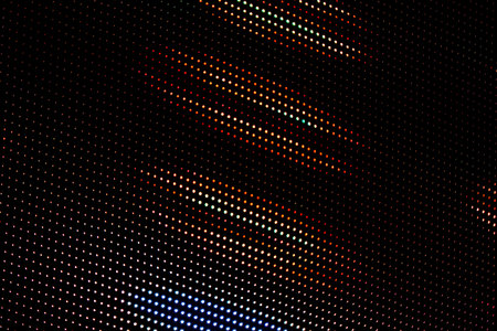 Orange and white light dots on black. For using as pattern and background.