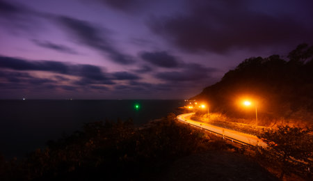 Winding road of Chaloem Burapha Chonlathit Road at night view from Noen Nang Phaya Viewpoint . The location in Na Yai Am, Chanthaburi, Thailand.の写真素材