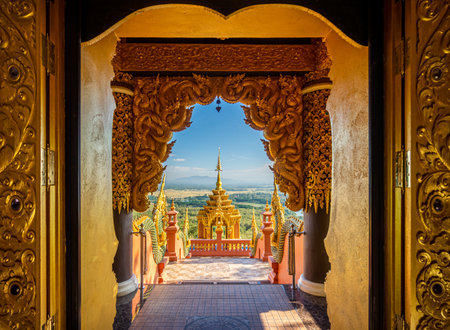 Wat Phra That Doi Phra Chan on the top hill of Doi Phra Chan mountain view from within Wihan door. This Buddhist temple is Lanna style architecture in Mae Tha, Lampang, Thailand.の写真素材