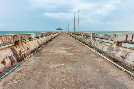 Old grunge concrete pier at Thung Wua Laen beach. It is in Chumphon province, Southern Thailand.の写真素材