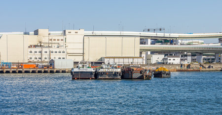 Cargo barges at sea port. This area is located at Osaka bay in Japan.のeditorial素材