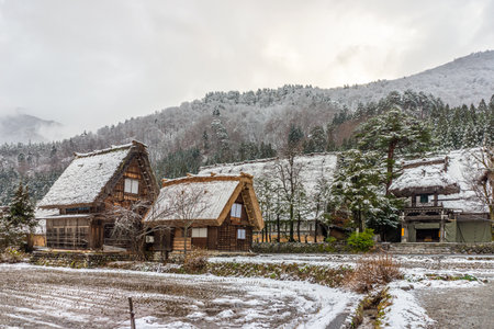 View of the remote mountain village of Gassho-Style houses at Shirakawa-go in winter. Shirakawa-go is a historic village one of UNESCO's World Heritage Sites in Shirakawa, Gifu Prefecture, Japan, Asia.のeditorial素材