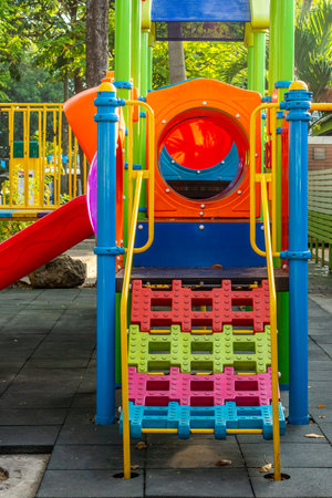 The colorful combination playground structure. It is a small outdoor playpark in public park.の写真素材