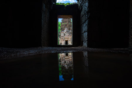 Main Tower of Prasat Ta Muean Tot view from in the archway. It is The Arokayasala or Hospital with Ancient Khmer Art of Bayon Style.の写真素材