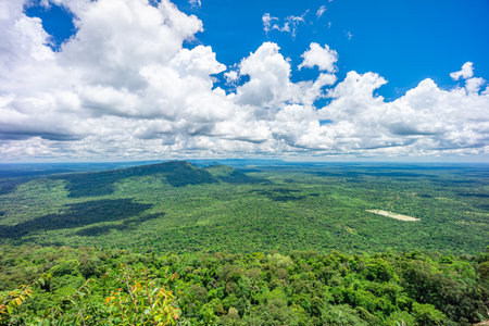 Landscape of Kingdom of Cambodia with cloudy sky. View from top of Pha Mo I Daeng viewpoint in Khao Phra Wihan National Park, Kantharalak,  Si Sa Ket, Thailand.の写真素材