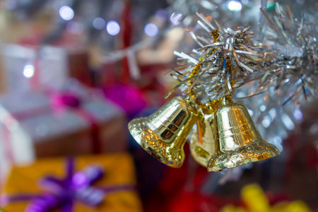 Christmas toy bells on artificial tree. Xmas bauble decoration are used to festoon the celebration.の写真素材