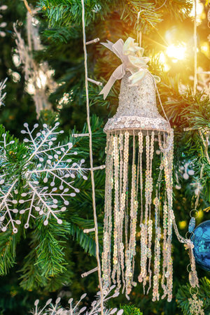 Close up Christmas ornaments on decorated artificial tree. Xmas baubles and other decorations are used to festoon the celebration.の写真素材