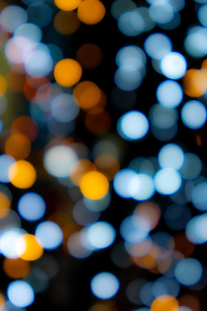 Abstract big circular bokeh background of Christmaslight,abstract background. Colorful blurry Christmas lights ornament at night.の写真素材
