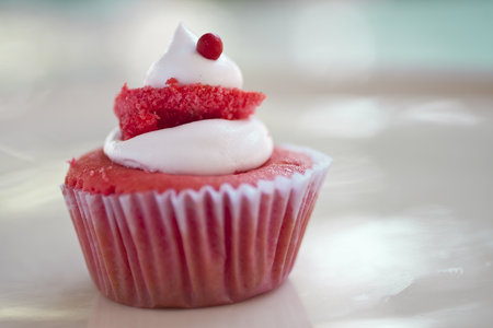 Strawberry CupCake Garnish with whipped cream and a small red ballの写真素材