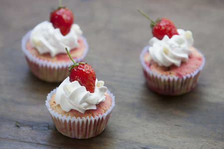Strawberry cupcake with Strawberry On the tableの写真素材