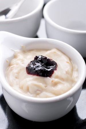 Prune yogurt with mulberry jam on top